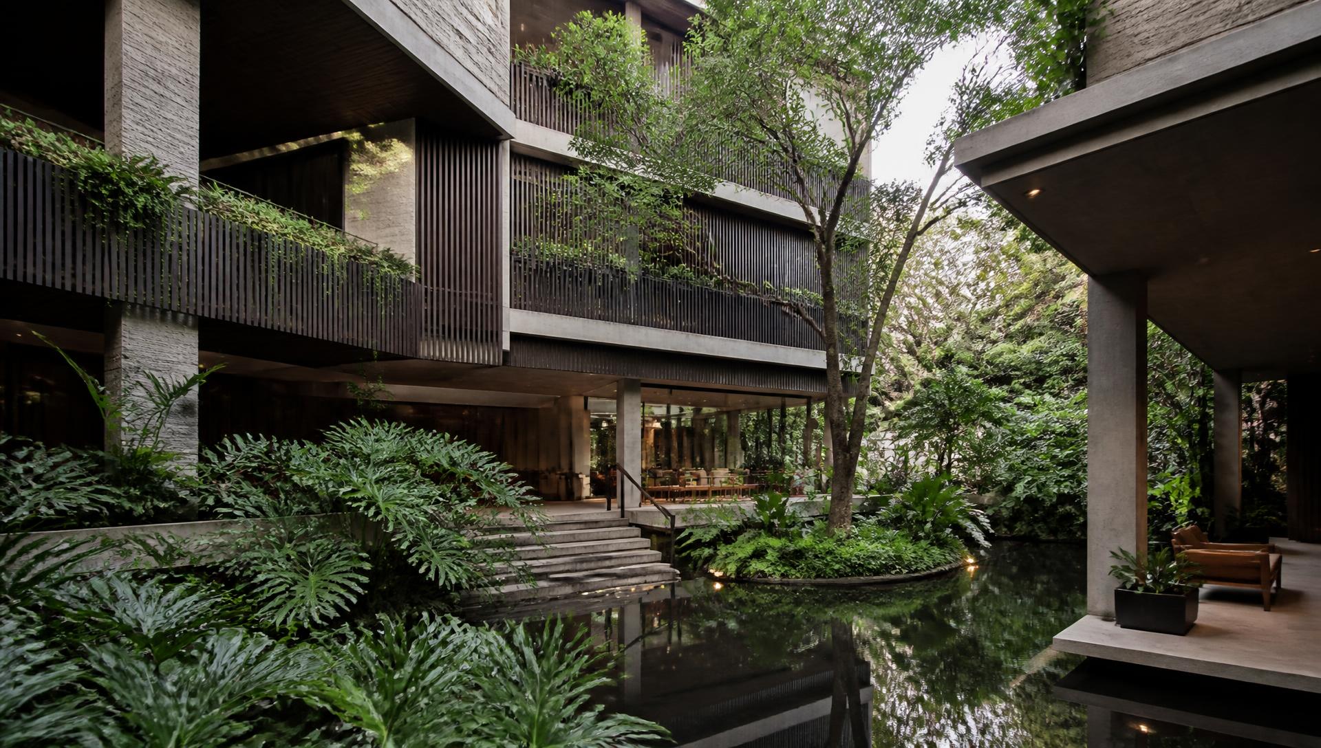Verdure House architecture surrounded by tropical planting